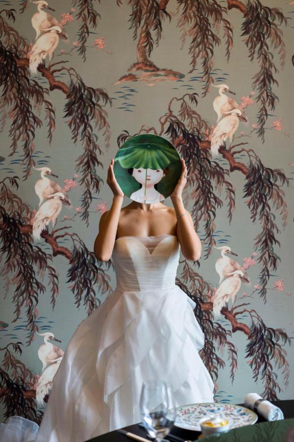 Andaz Singapore, By Hyatt Exterior photo A model wearing a dress by the designer